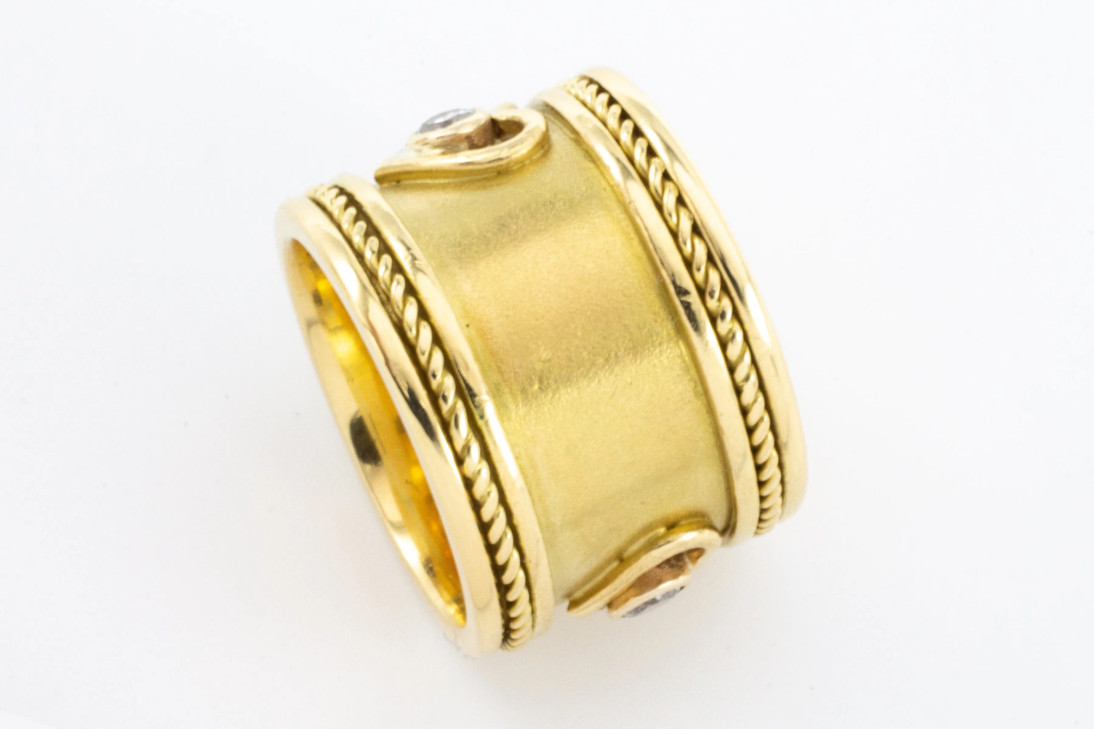 An 18 carat gold Elizabeth Gage style ring with diamonds